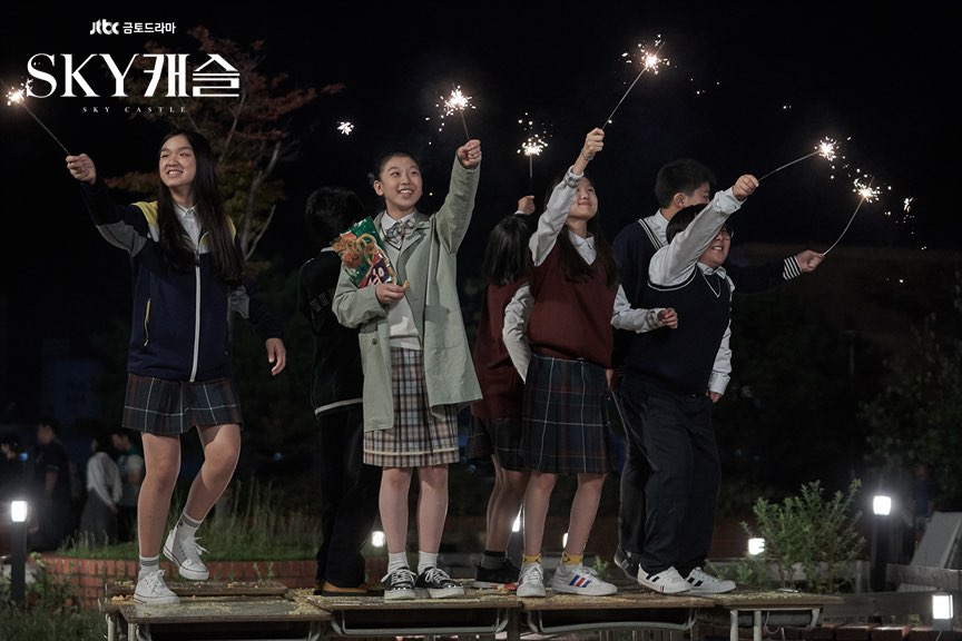 kang ye-bin and other students using fireworks and being happy