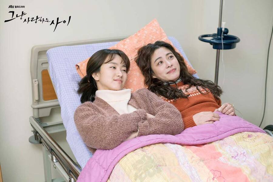 moon-soo and wan-jin lying on a hospital bed together and talking in rain or shine